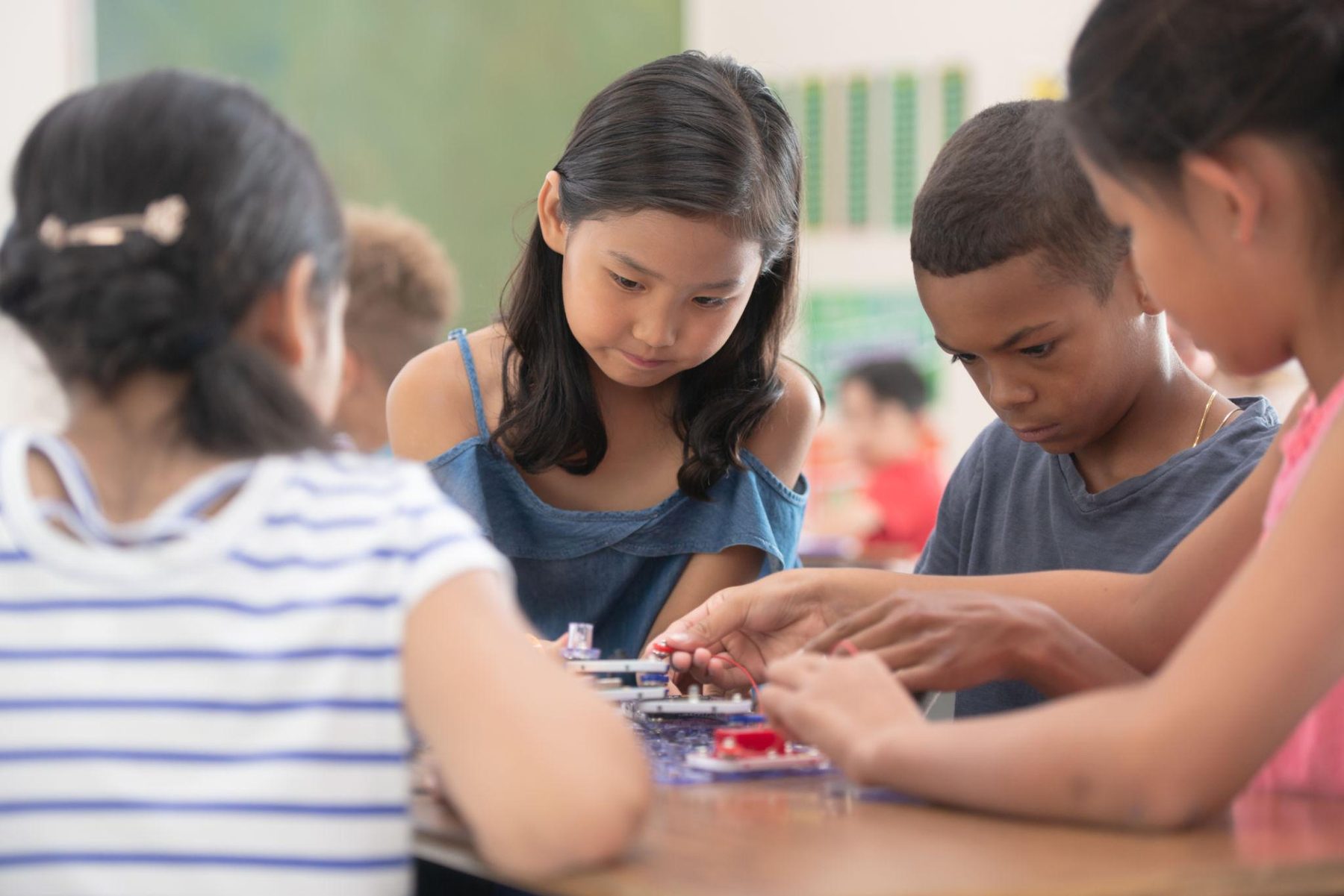 Children collaborating on a hands-on academic project